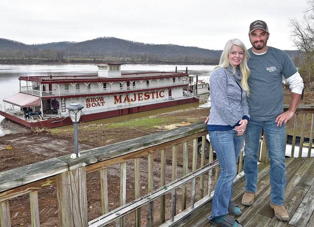 126138881_web1_showboat
In this file photo, owners of the Riverboat Majestic, Joe and Cortnee Brumley, are shown with the boat at their home near Manchester, Ohio.