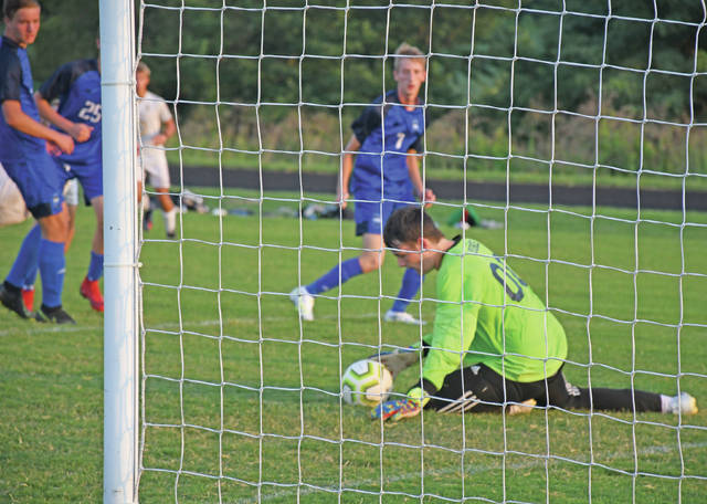 Mason Countys Andrew Moore makes a save in net during their contest with Rowan County. (Evan Dennison, The Ledger Independent)