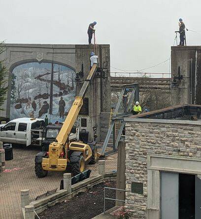 127749064_web1_ontop
Maysville city employees prepare the floodwall opening at Limestone Landing for the gate normally inserted during the winter months in anticipation of a floodwall inspection.