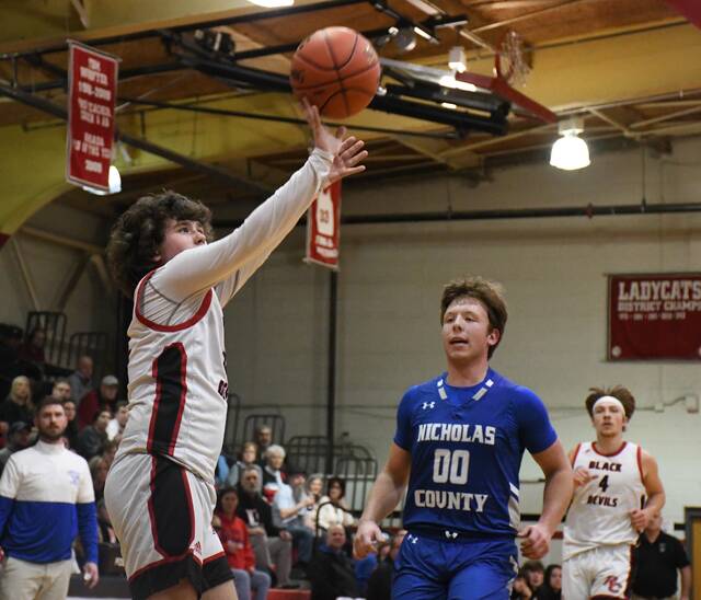 Robertson Countys Noah Bussell puts up a jumper in the first half against Nicholas County, Wednesday, in Falmouth for the 38th District Tournament semifinals. (Evan Dennison, The Ledger Independent)