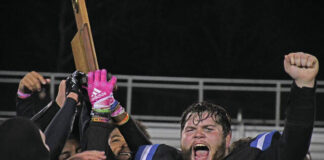 
			
				                                Mason County’s Wyatt Fuller (72) throws his hands up in the air after the Royals were awarded the region championship trophy. (Evan Dennison, The Ledger Independent)
 
			
		