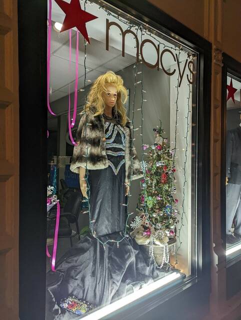 A mannequin dressed in 1950s Barbie Doll attire.