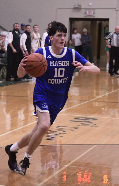 <p>Ben Brookbank charges down the court.</p>