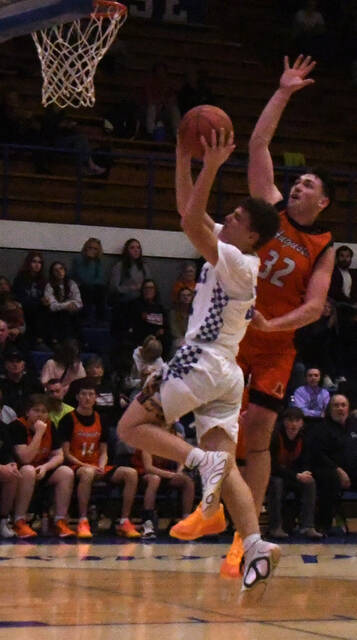 132003651_web1_merz
Jace Merz goes up for a shot.